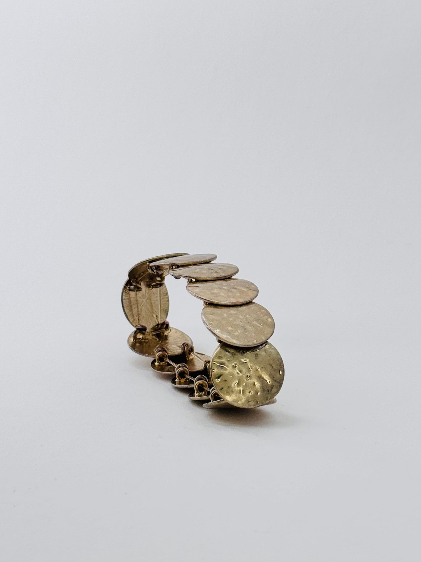 Golden metal hammered bracelet