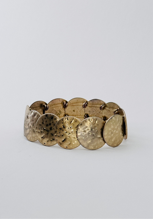 Golden metal hammered bracelet
